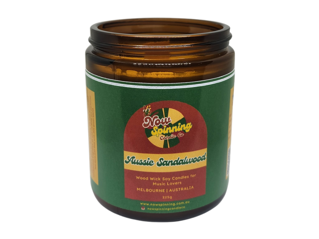 Candle jar with a green label on a white background