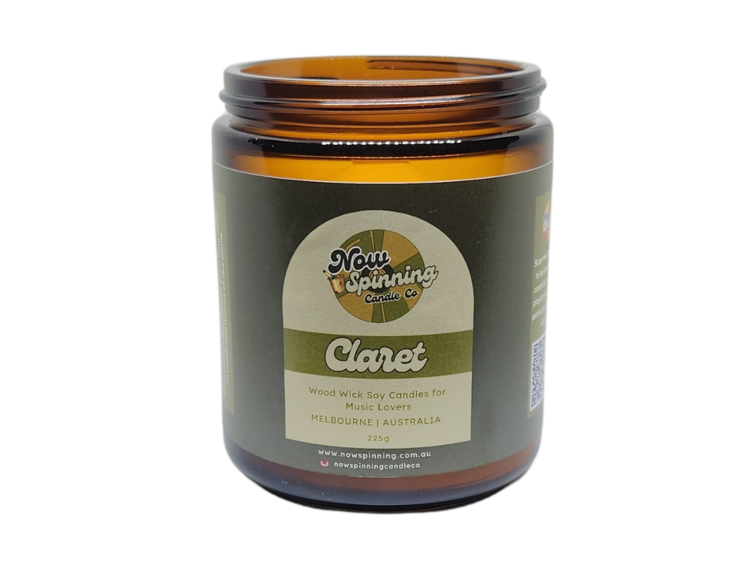 A brown amber glass jar with a black screw top lid, labeled as 'Claret' with a green and yellow brand logo.