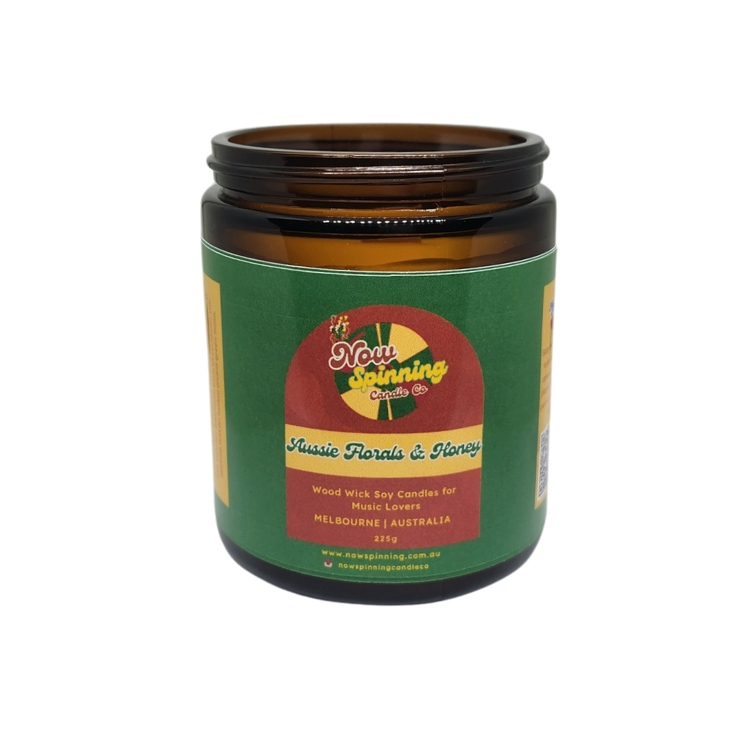 Candle jar with a green label on a white background