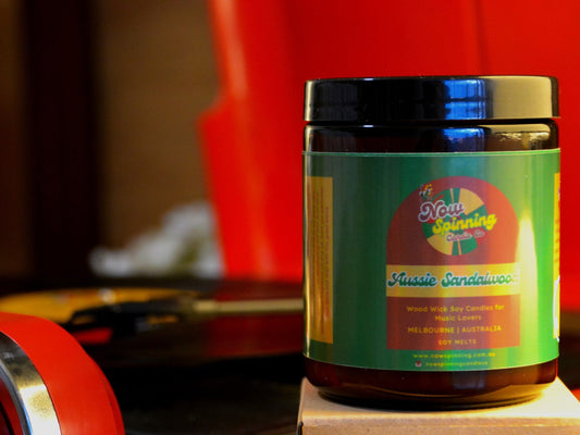 Aussie Sandalwood candle with colorful label on a blurred background