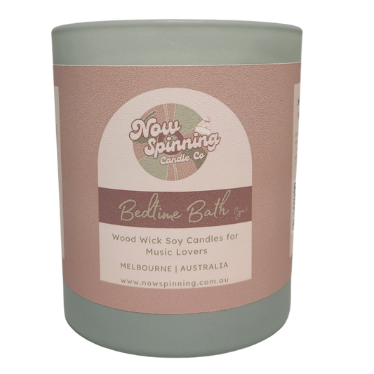 Bedtime Bath soy candle with wood wick and curated playlist, featuring calming chamomile, jasmine and lily fragrance notes.