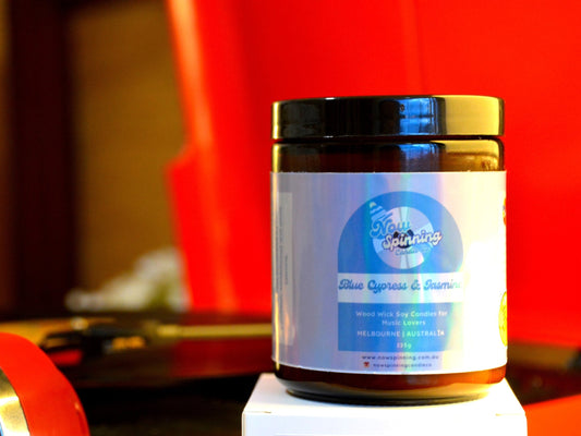 Blue Cypress & Jasmine Candle with a red record player
