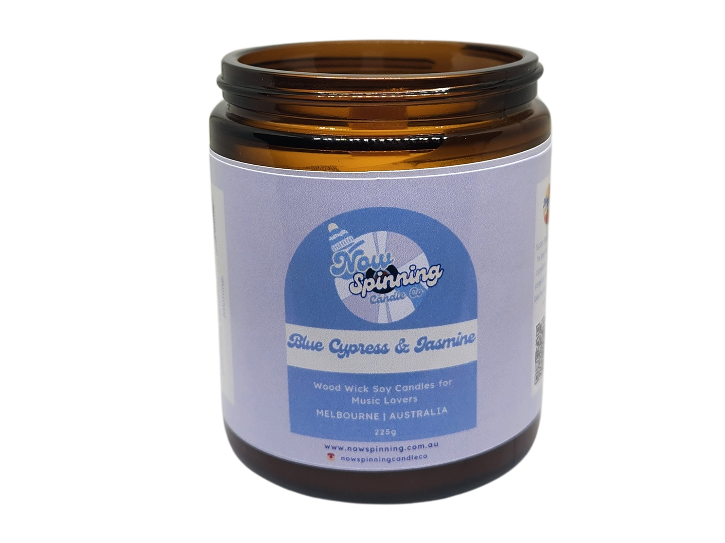 Blue Cypress and Jasmine Candle jar with a label on a white background