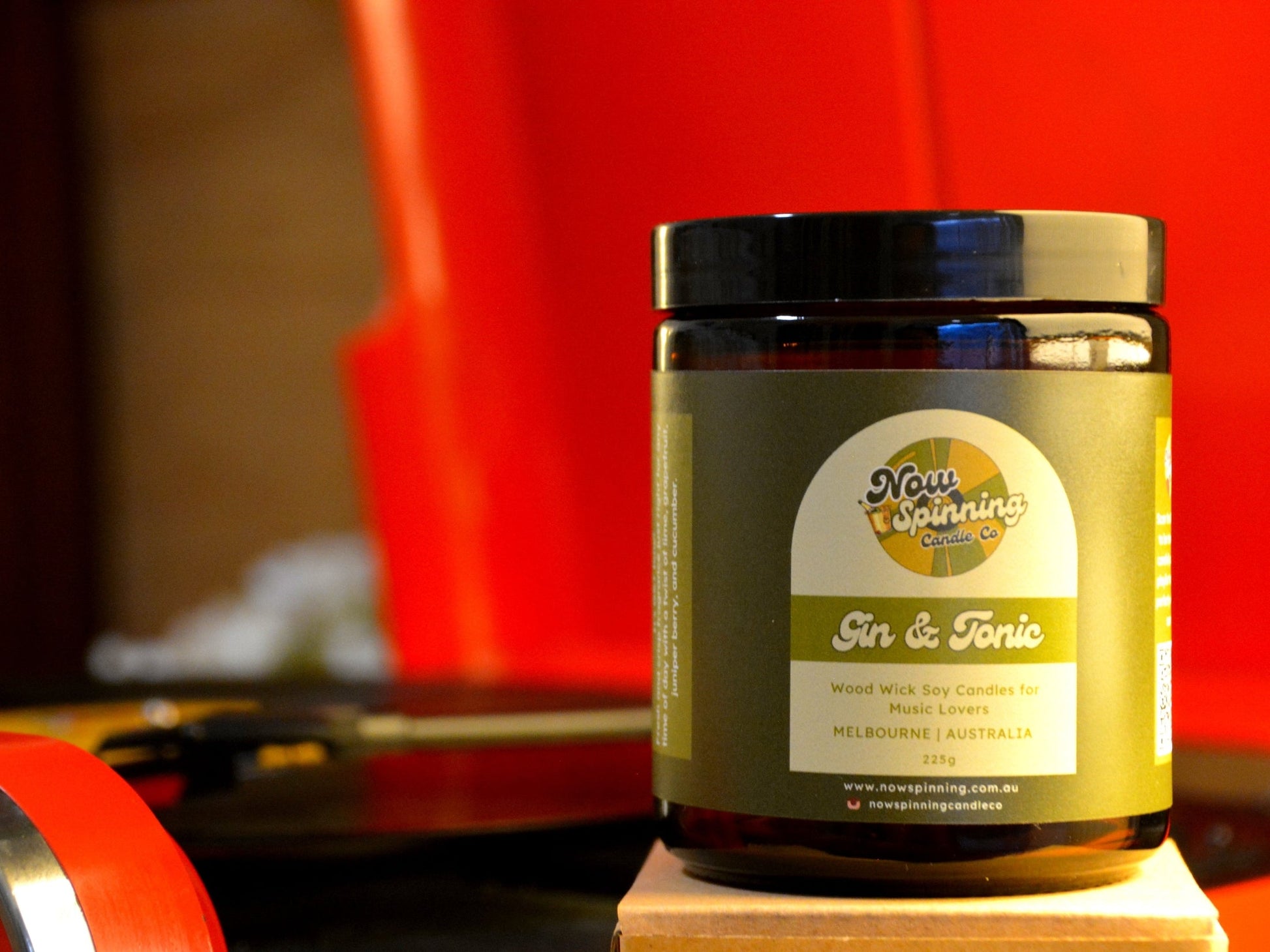 Jar of 'Now Spinning' Gin & Tonic candle with a red record player