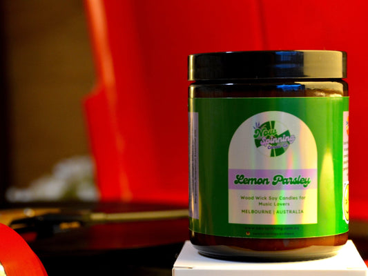 Lemon Parsley candle with a green label with a red record player