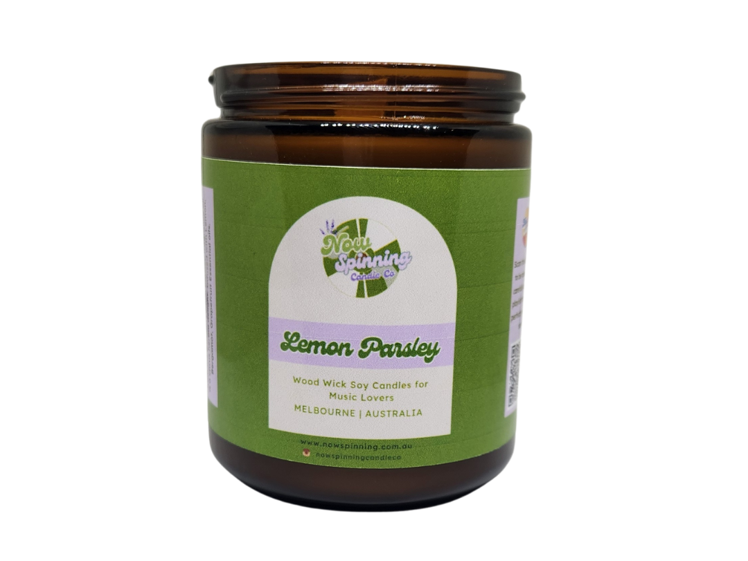 Candle jar with green label on a white background
