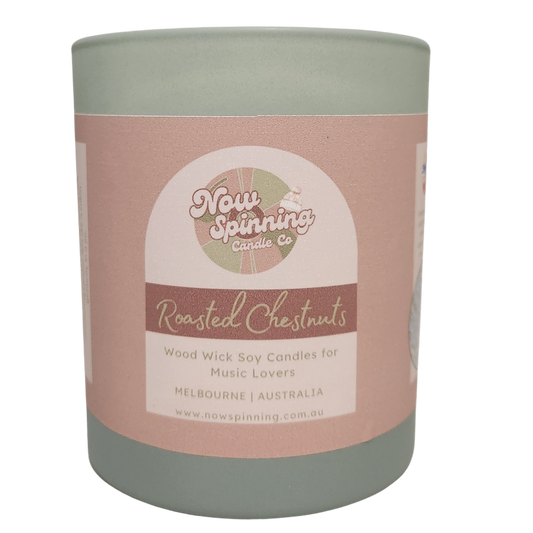 Roasted Chestnuts wood wick soy candle by Now Spinning Candle Company. A cosy winter candle featuring warm roasted chestnut, vanilla and maple notes, paired with a curated playlist for the ultimate winter soundtrack.